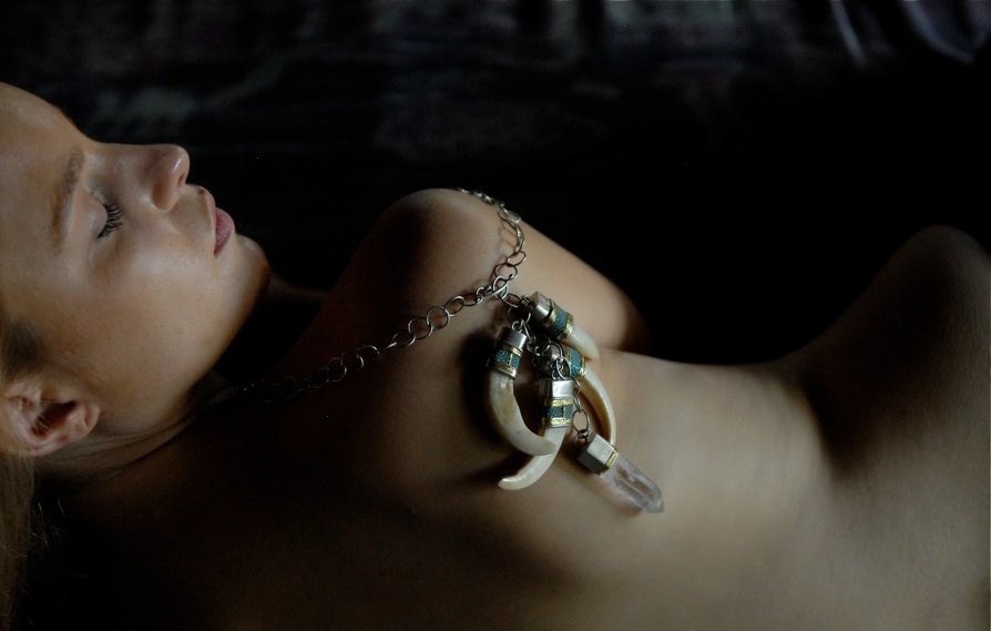 A pendant by Jeane Seah worn on bare skin