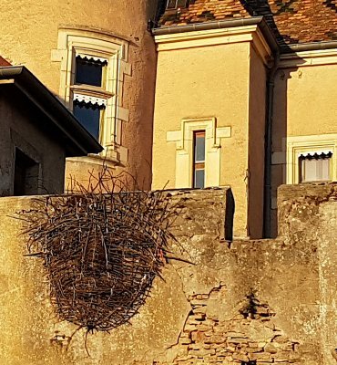 A woven face on the wall of a château